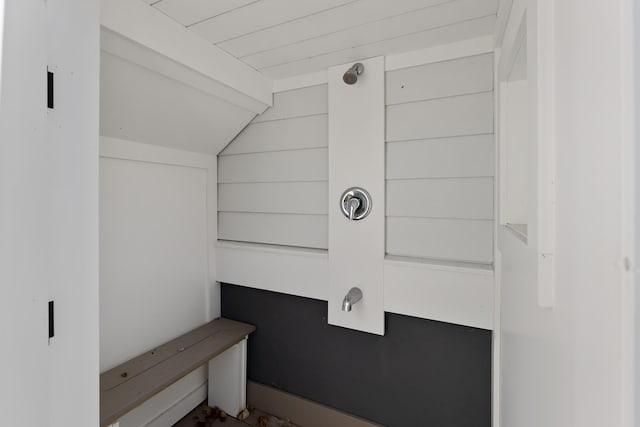 bathroom featuring lofted ceiling