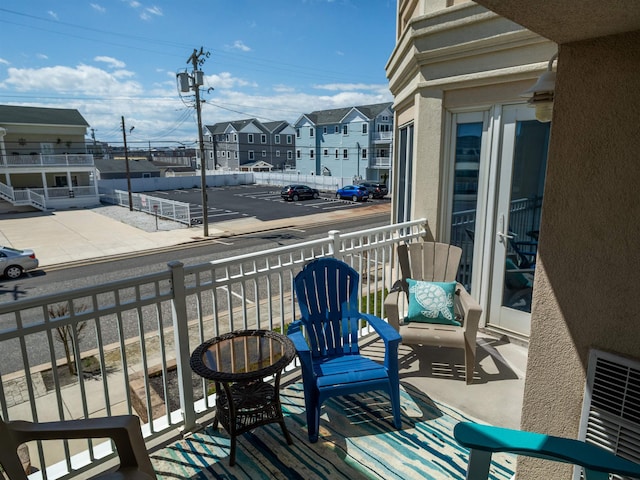 balcony with a residential view and visible vents