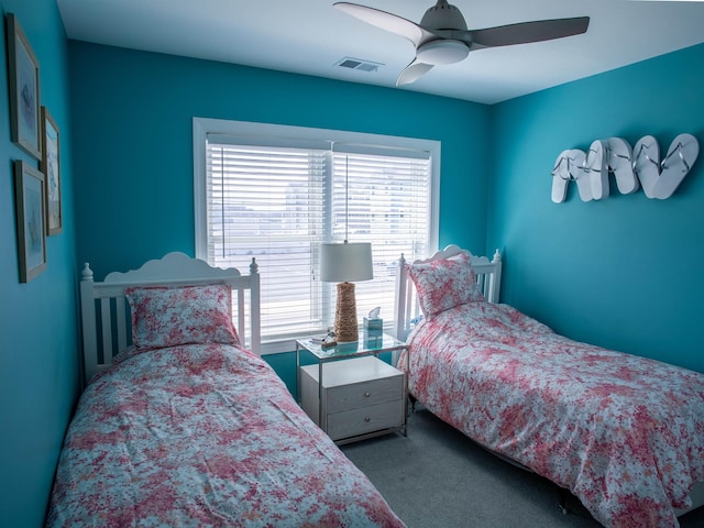bedroom featuring visible vents, carpet, and ceiling fan