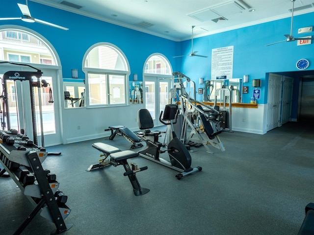 gym with visible vents, a ceiling fan, french doors, crown molding, and baseboards