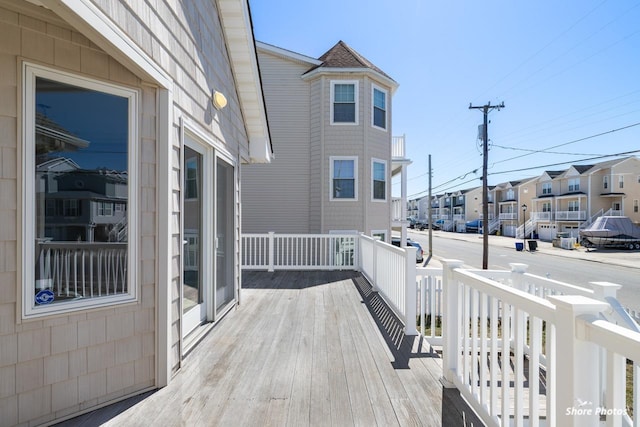 wooden deck with a residential view