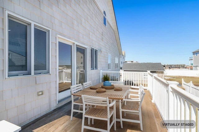balcony featuring outdoor dining space