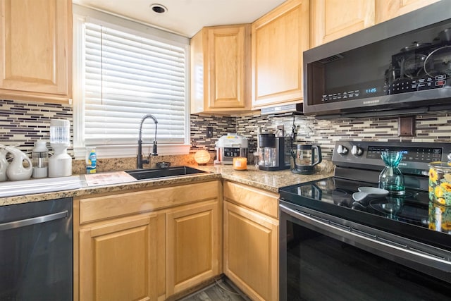 kitchen featuring decorative backsplash, light brown cabinets, range with electric stovetop, black dishwasher, and sink