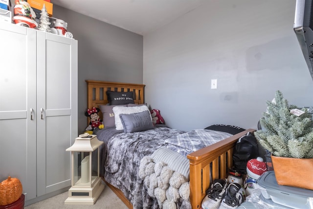 bedroom with light colored carpet