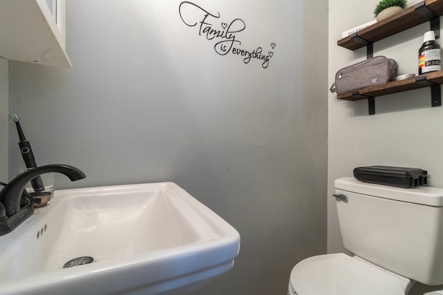 bathroom with sink and toilet