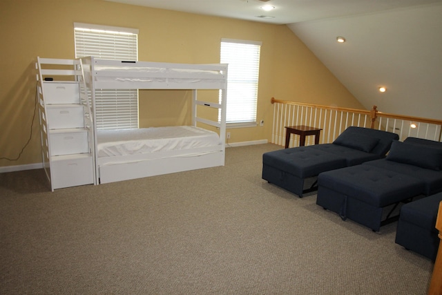 unfurnished bedroom with baseboards, vaulted ceiling, carpet flooring, and recessed lighting