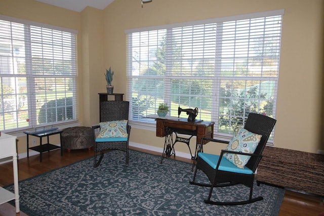 sitting room with wood finished floors and baseboards