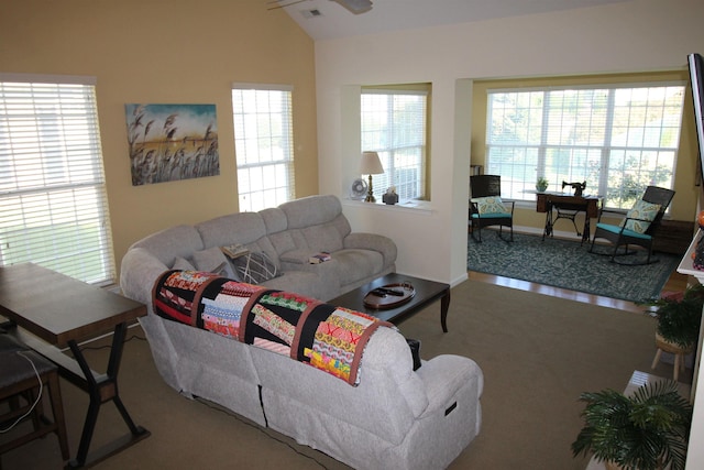 living room with lofted ceiling and visible vents