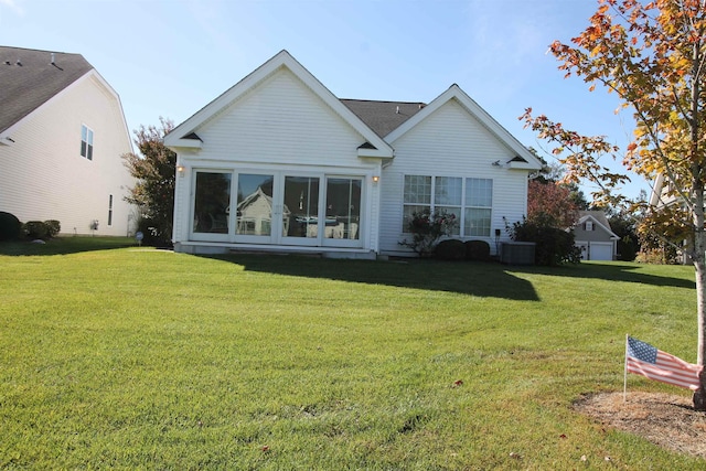 rear view of house with a yard