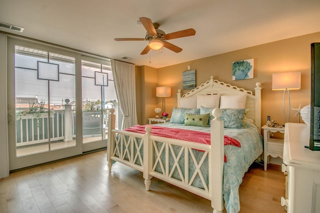 bedroom featuring access to outside, ceiling fan, and hardwood / wood-style flooring