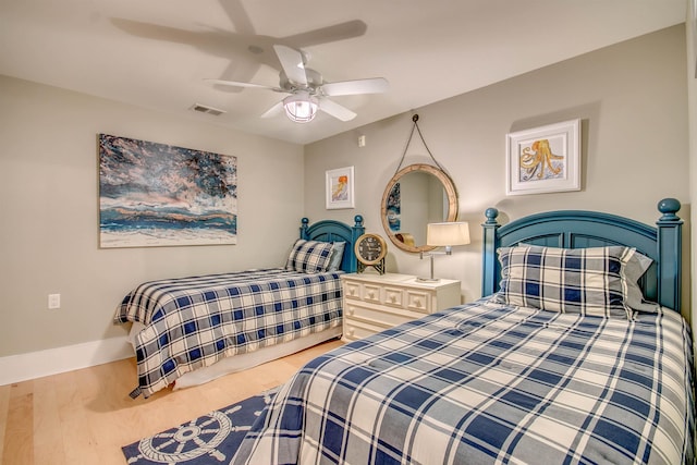 bedroom featuring hardwood / wood-style flooring and ceiling fan