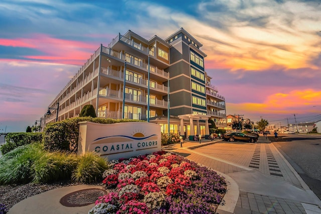 view of outdoor building at dusk