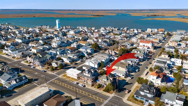 birds eye view of property featuring a water view