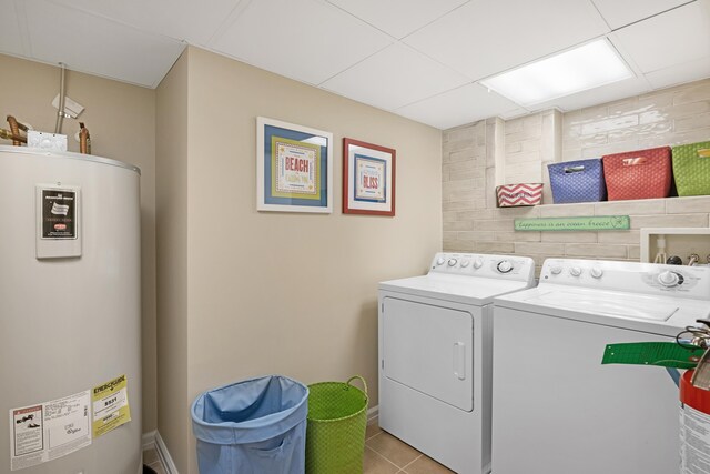 9601 Atlantic Ave Unit 310, Lower Township, NJ 08260 - laundry area with water heater, washer and clothes dryer, and light tile patterned floors