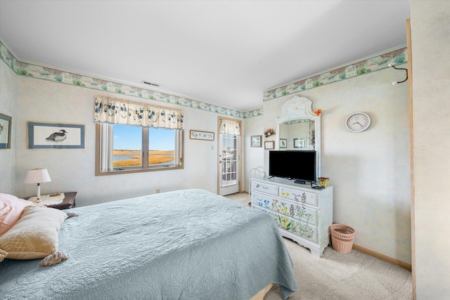 bedroom with light colored carpet