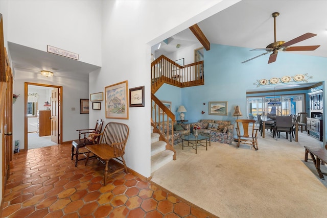 carpeted living room with beamed ceiling, ceiling fan, and high vaulted ceiling