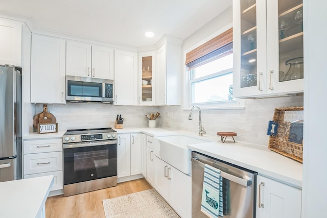 6110 Seaview Ave, Wildwood Crest, NJ 08260 - kitchen featuring stainless steel appliances, white cabinets, light countertops, and recessed lighting