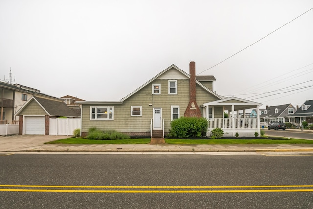 6110 Seaview Ave, Wildwood Crest, NJ 08260 - view of front of property featuring a garage, a porch, and driveway