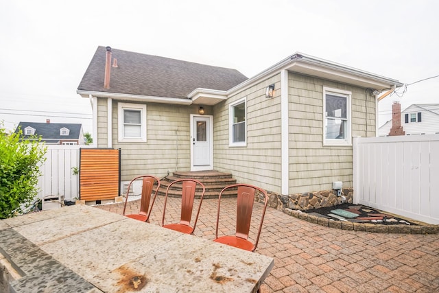 6110 Seaview Ave, Wildwood Crest, NJ 08260 - rear view of house with a patio area and roof with shingles