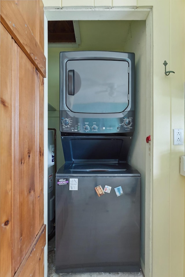 washroom with stacked washer and dryer