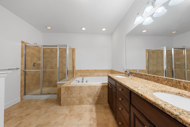 bathroom with tile patterned floors, vanity, and separate shower and tub