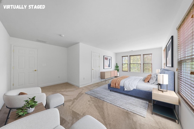 bedroom with light colored carpet