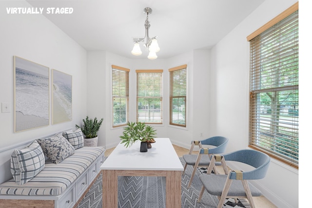 living area featuring a chandelier