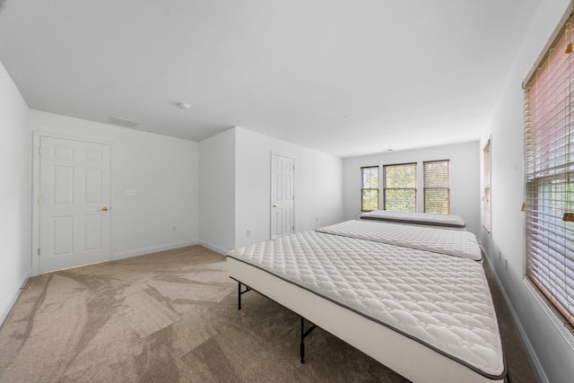 unfurnished bedroom featuring light colored carpet