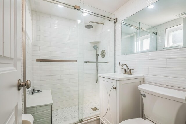 405 Ocean Ave Unit 110, North Wildwood, NJ 08260 - full bathroom featuring a shower stall, vanity, and tile walls