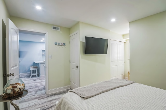 405 Ocean Ave Unit 110, North Wildwood, NJ 08260 - bedroom featuring light wood finished floors, recessed lighting, and a closet