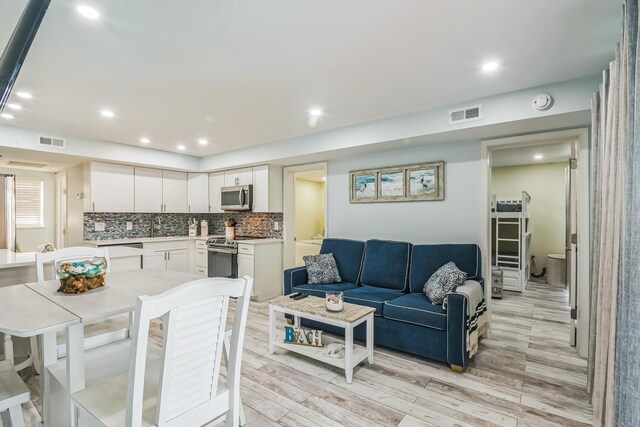 405 Ocean Ave Unit 110, North Wildwood, NJ 08260 - living room with light wood-style flooring and recessed lighting