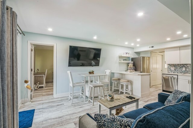 405 Ocean Ave Unit 110, North Wildwood, NJ 08260 - living room featuring recessed lighting and light wood finished floors