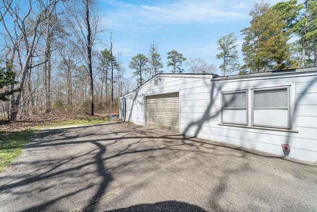 view of property exterior featuring a garage