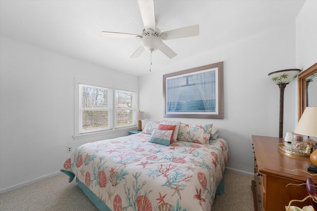 bedroom with ceiling fan and light carpet