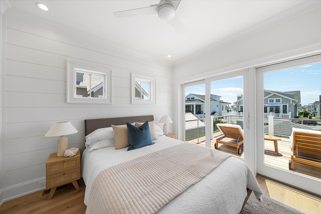 bedroom with wood-type flooring, access to exterior, and ceiling fan