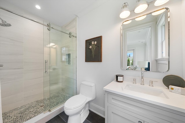 bathroom featuring vanity, toilet, an enclosed shower, and tile patterned flooring