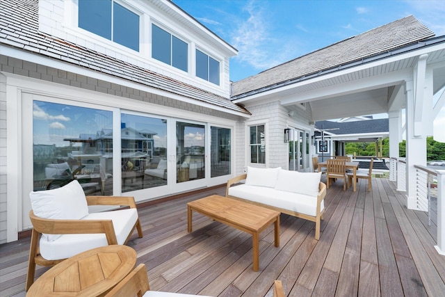 wooden terrace featuring an outdoor hangout area