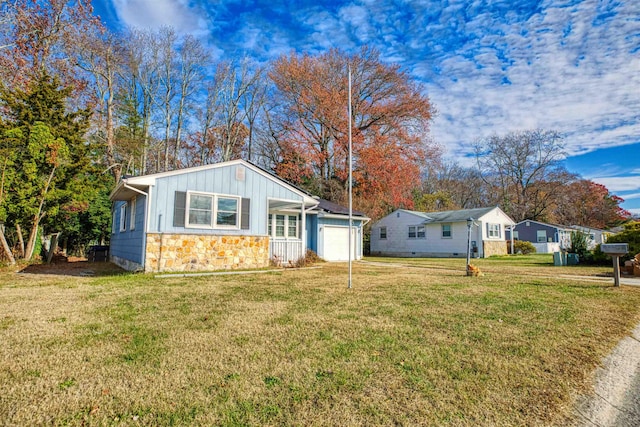 exterior space with a garage and a front lawn