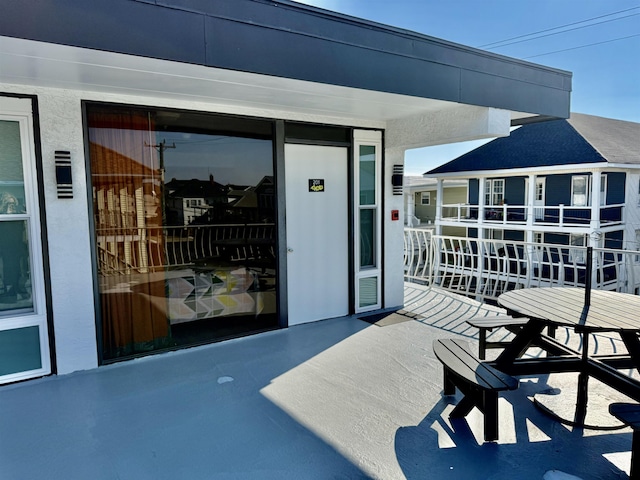 view of patio / terrace with a balcony