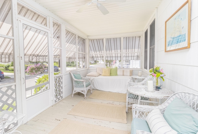 sunroom featuring ceiling fan