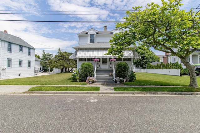 view of front of property with a front lawn