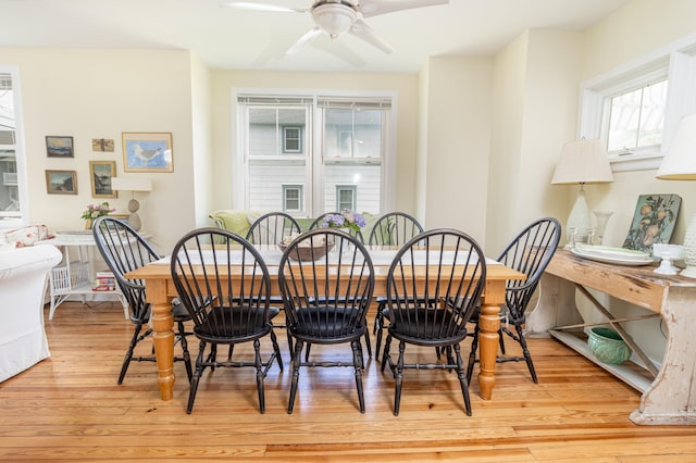 dining room with light wood-type flooring and ceiling fan