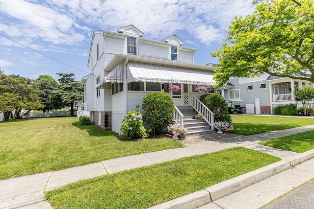 view of front facade with a front yard