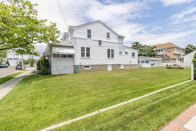 rear view of house with a lawn