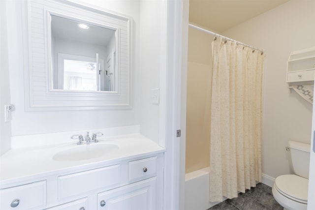 full bathroom featuring tile patterned flooring, toilet, vanity, and shower / tub combo with curtain