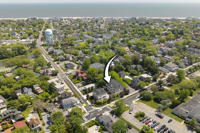 bird's eye view featuring a water view and a residential view