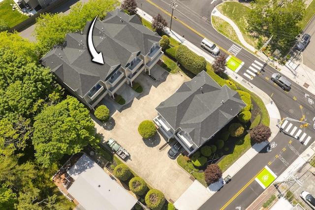 birds eye view of property with a residential view