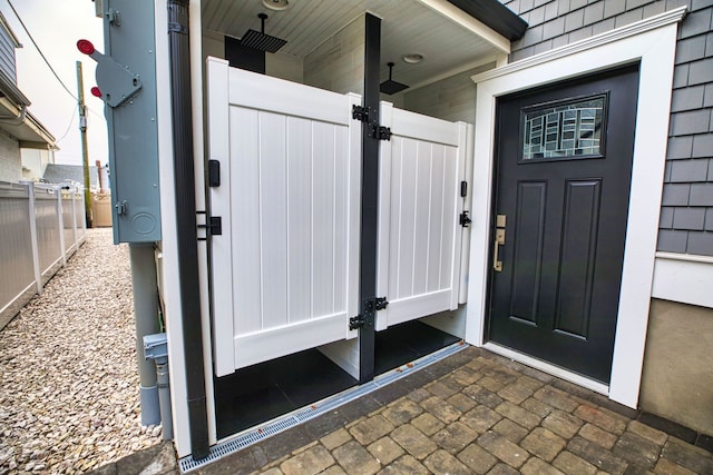 property entrance with fence and a gate