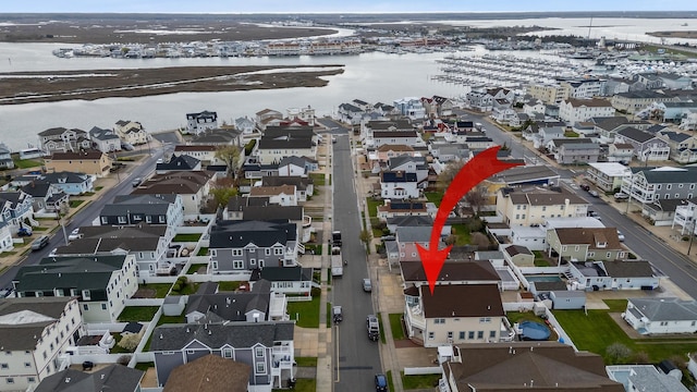 aerial view with a water view and a residential view