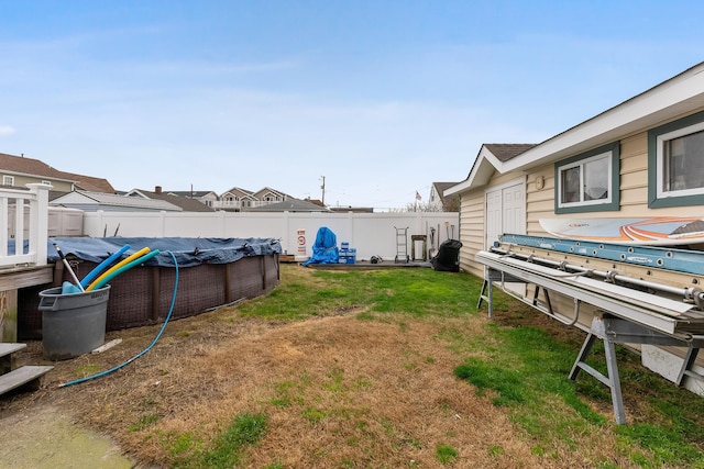 view of yard with a fenced backyard and a fenced in pool
